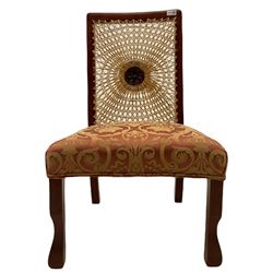 Early 20th century walnut framed bedroom chair, bergere cane back with centre motif, upholstered seat