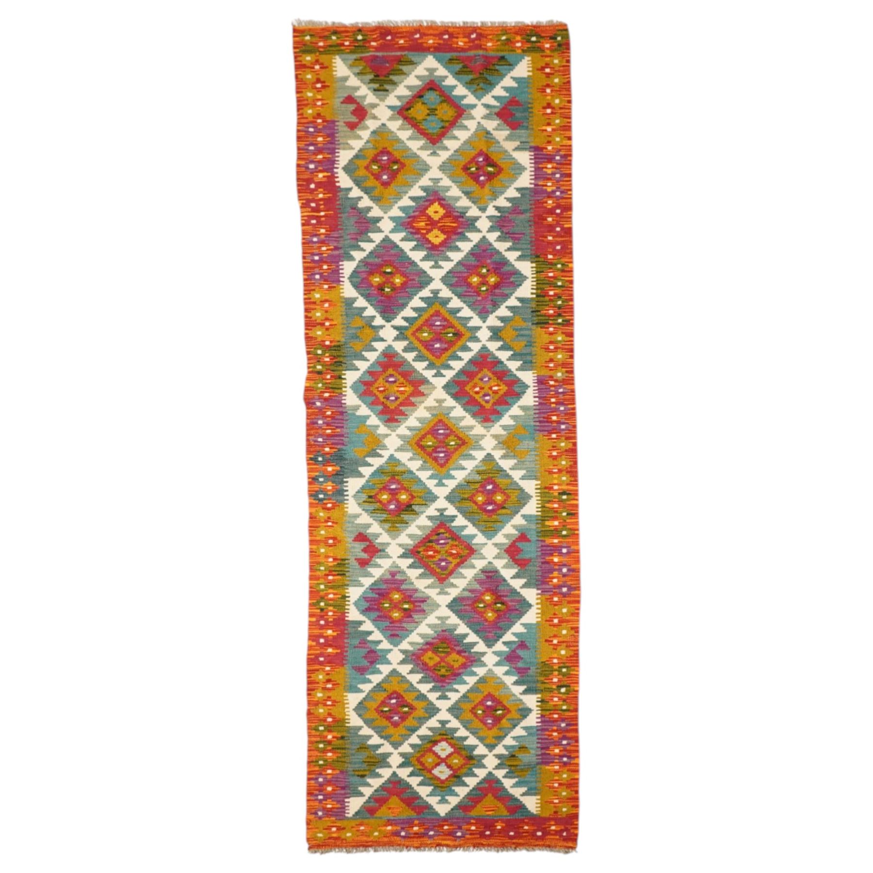 Afghan Maimana flatweave kilim runner, central field features large bold nested diamond motifs and stylized geometric lozenge patterns on olive purple, ochre, blue, and green tone ground, border stripe in orange and crimson ground, and fringe