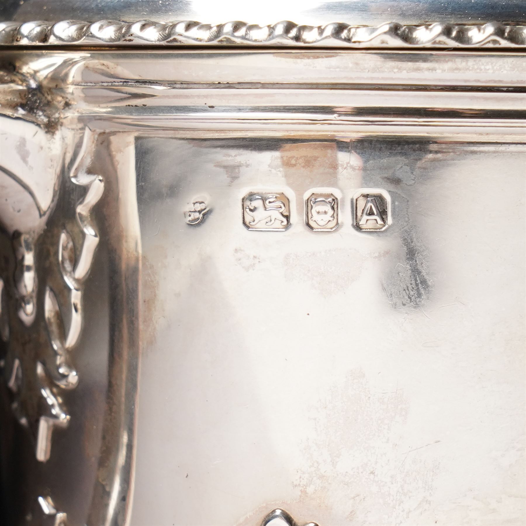 Silver two handled cup and cover with loop handles, raised stylised leaves and gadrooned edge H11cm London 1936 Maker Goldsmiths & Silversmiths Co. Ltd