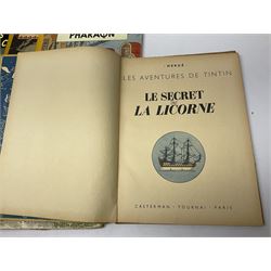 Twenty one first edition Herge, 'The Adventures of Tin Tin' books published by Casterman Bruxelles, with French text and coloured comic strip illustrations throughout; comprising Tintin Au Congo 1946, Tintin En Amerique 1946, Les Cigares du Pharaon 1955, Le Lotus Bleu 1946, L'Oreille Cassee 1943, L'ile Noire 1943, Le Sceptre d O'ttokar 1947, Le Crabe Aux Pinces D'or 1943, L'Etoile Mysterieuse 1942, Le Secret de la Licorne 1943, Le Tresors de Rackan Le Rouge 1945, Les 7 Boules de Cristal 1948, Le Temple du Soleil 1949, Au Pays de L'Or Noir 1950, Objectif Lune 1953, On a Marche sur la Lune 1954, L'Affaire Tournesol 1956, Coke en Stock 1958, Tintin au Tibet 1960, Les Bijous de la Castafiore 1963 and Vol 714 Pour Sydney 1968
