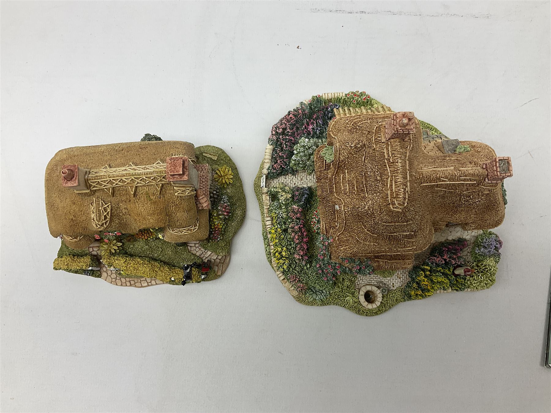Seven Lilliput Lane cottages, comprising five limited edition examples, one French collection example and one Dutch collection, to include Queen of Windemere, Penkill Castle and Gertrude's Garden, all with boxes, four with deeds