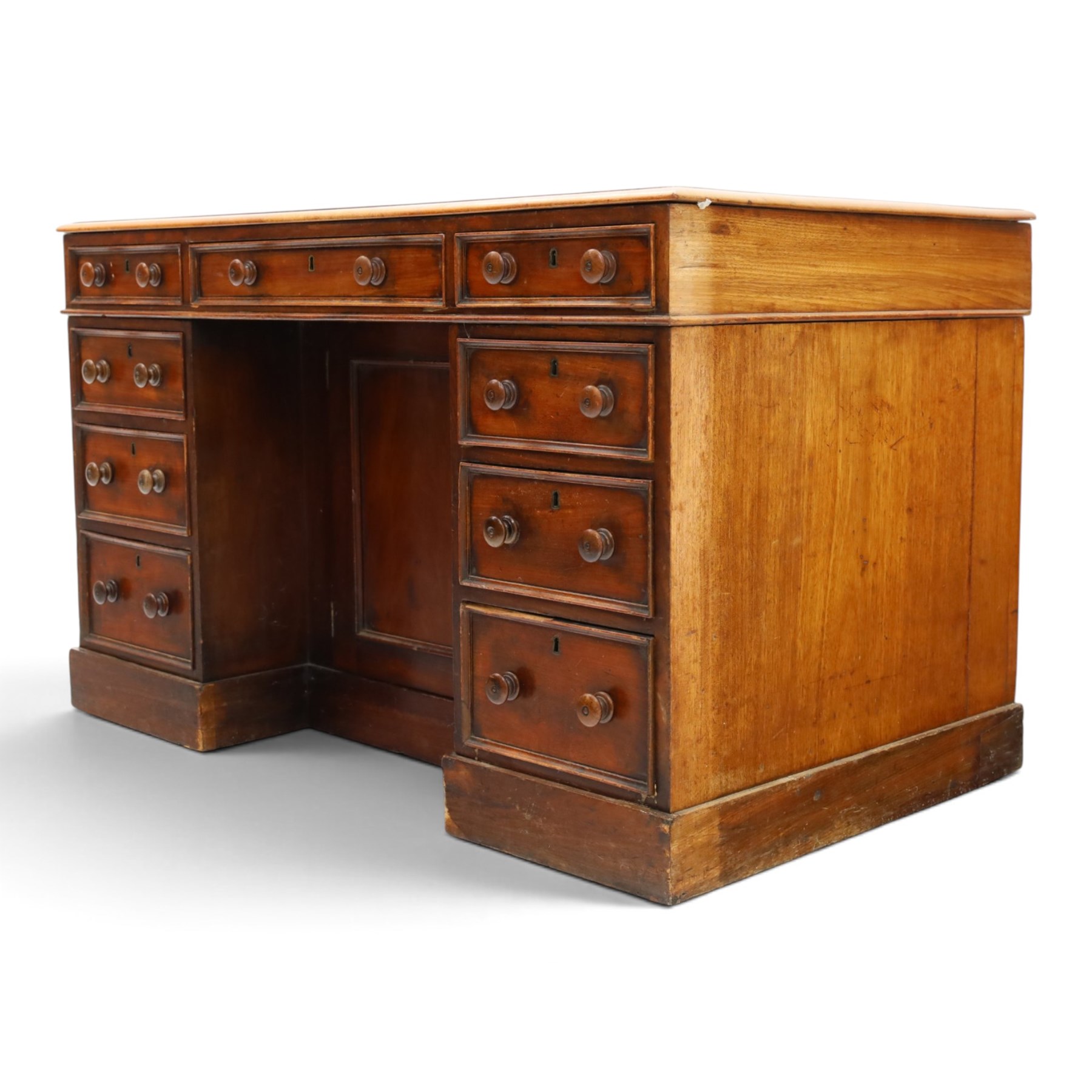 Victorian mahogany kneehole desk, rectangular top fitted with central frieze drawer over recessed cupboard, flanked by four graduating drawers to each side, on skirted base