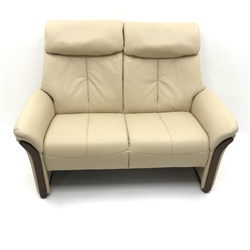  Komfort two seat sofa, upholstered in beige leather (W141cm) and two matching swivel recliner chairs (W82cm) (3)  