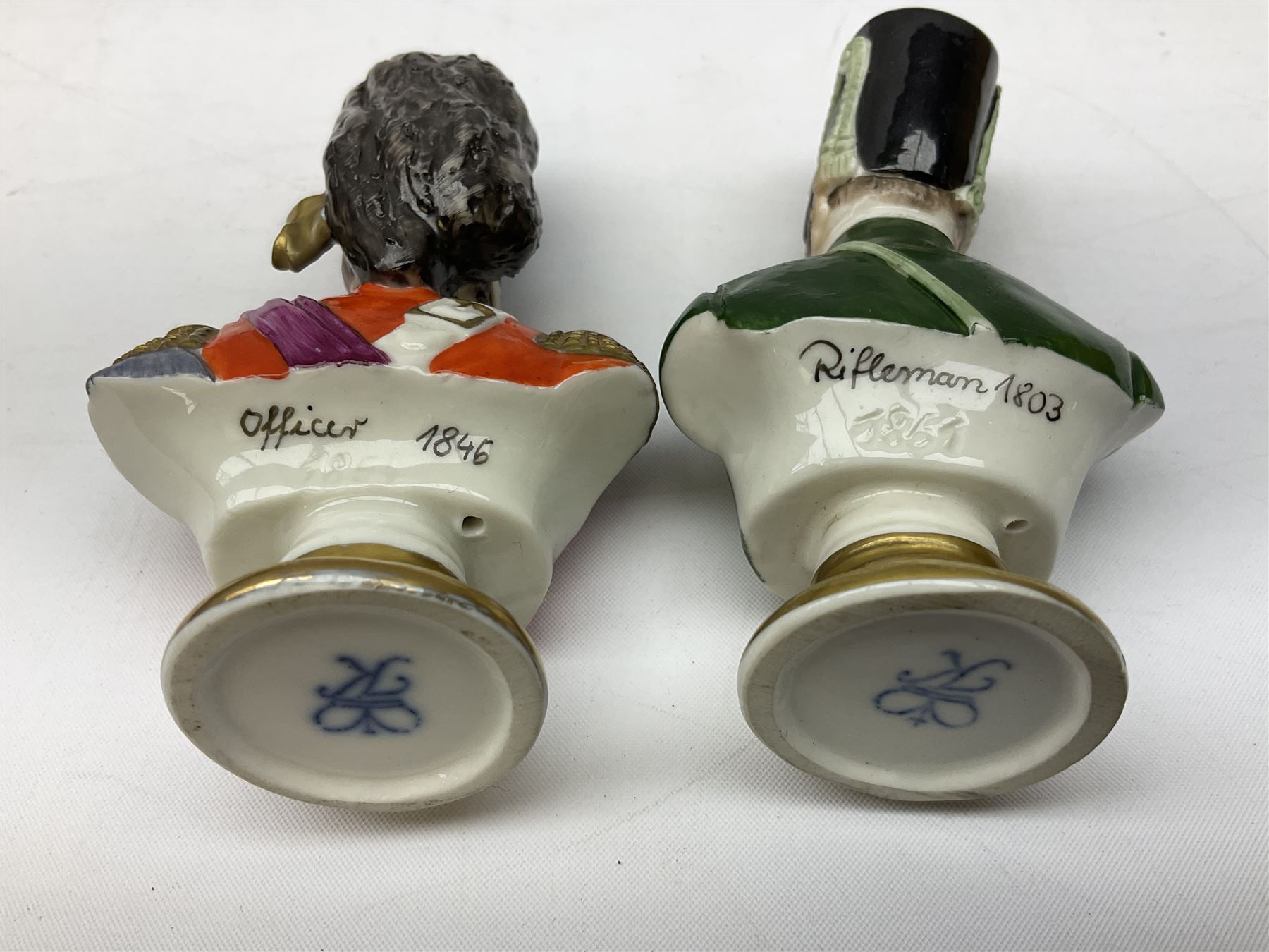 Group of Napoleonic busts comprising ‎Rudolf Kämmer Volkstedt examples of General Jean Lannes, 1st Duc de Montebello and Scottish Highland Infantry soldier and Rifleman 1803, all with blue crowned K marks beneath, and a bust of Napoleon raised upon square plinth, tallest H12cm