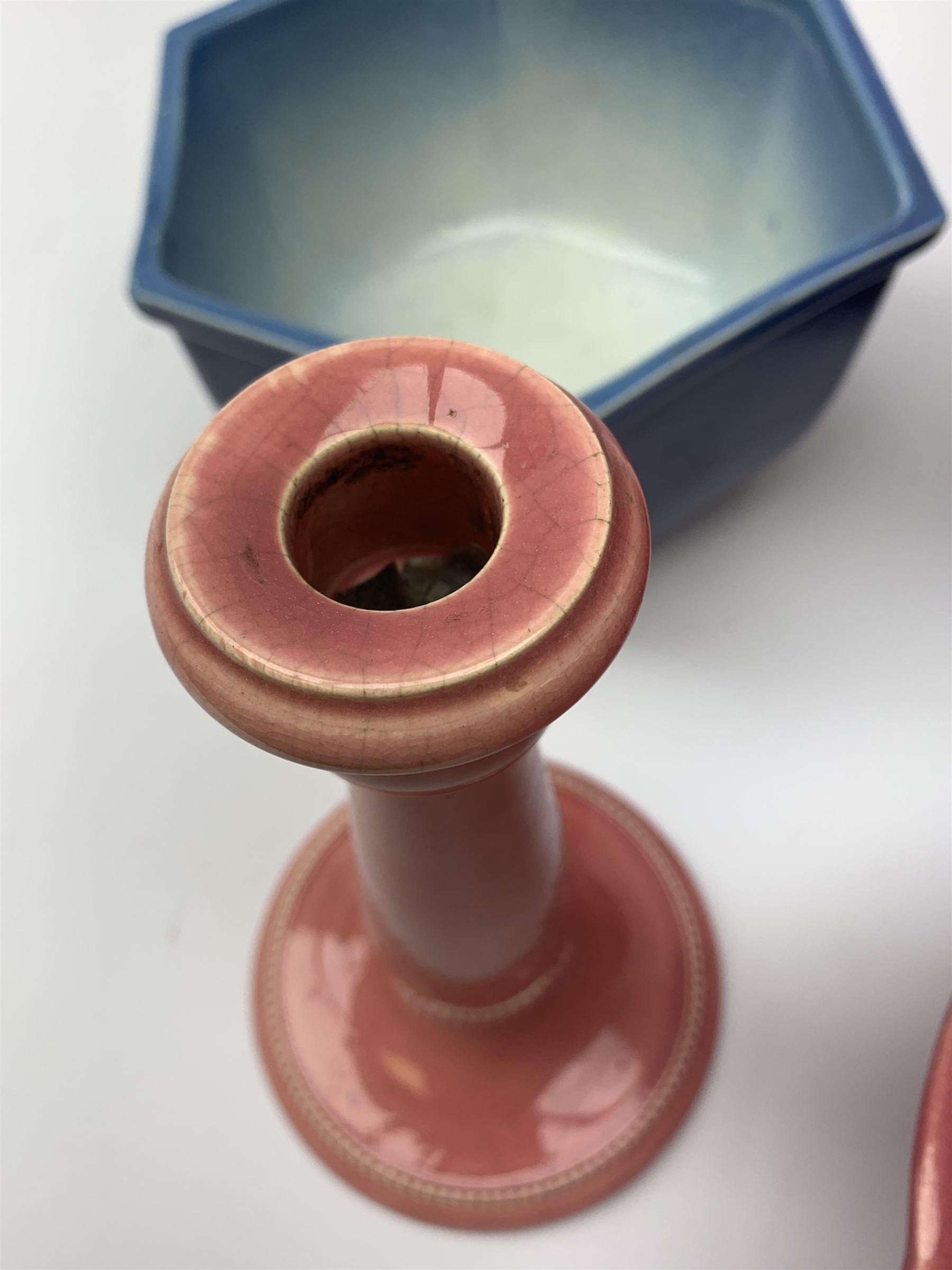 Two Bretby jardinières, hexagonal planter and trumpet shaped vase,  preserve pot and chamberstick together with an Ault pink glazed candlestick and low comport (8)