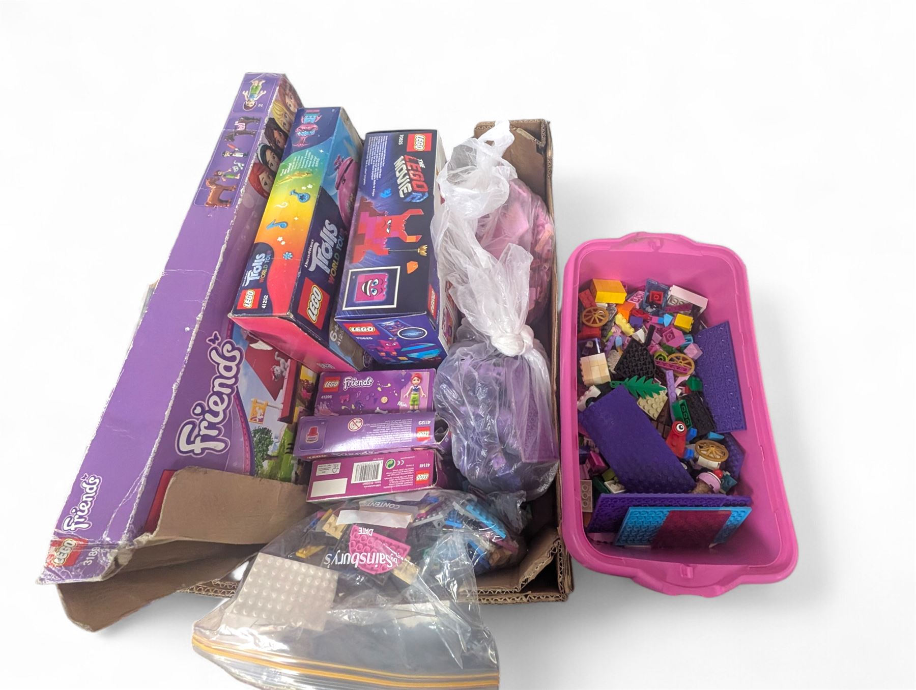 Lego Friends no. 3189 Stables set, Lego Trolls no. 41252 World Tour set, The Lego Movie set no. 70825, three small Lego Friends sets, all boxed and a quantity of loose Lego, including purple and pink colourways