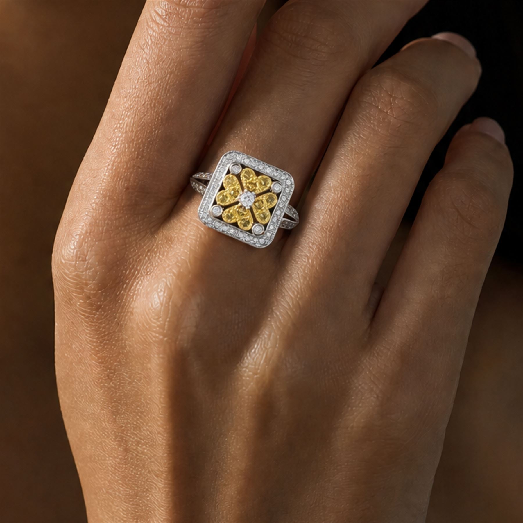 18ct white gold diamond flower head dress ring, milgrain set with sixty-five fancy yellow and white diamonds, with diamond set shoulders, stamped 750, total diamond weight 1.00 carat, with World Institute Report