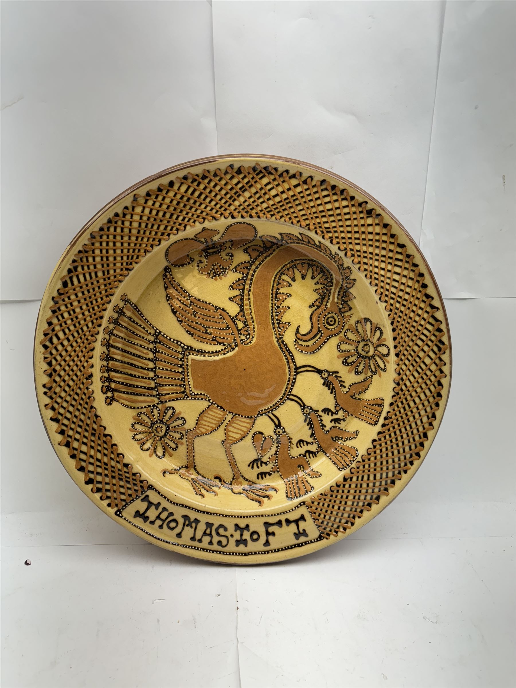 John Hudson: Large slipware charger in the style of Thomas Toft by John Hudson of Mirfield Pottery, decorated with a cockerel, incised marks verso, D 41cm.