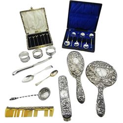 Assorted silver, to include mid/late 20th century matched four piece silver mounted dressing table set, comprising handheld mirror, hair brush, clothes brush, and comb, each with scrolling repousse decoration, hallmarked W I Broadway & Co, Birmingham 1958, 1971, 1972 and 1991, set of six 20th century cocktail sticks, the terminals modelled as cockerels, stamped Sterling Silver, contained within a case, a matched set of six early/mid 20th century teaspoons, hallmarked Charles Perry & Co, Chester 1929, and James Deakin & Sons, Sheffield 1934, contained within a fitted case, a William IV Fiddle pattern teaspoon, hallmarked David Phillips, London 1835, two 20th century napkin rings, etc., total weighable silver 5.71 ozt (177.7 grams)