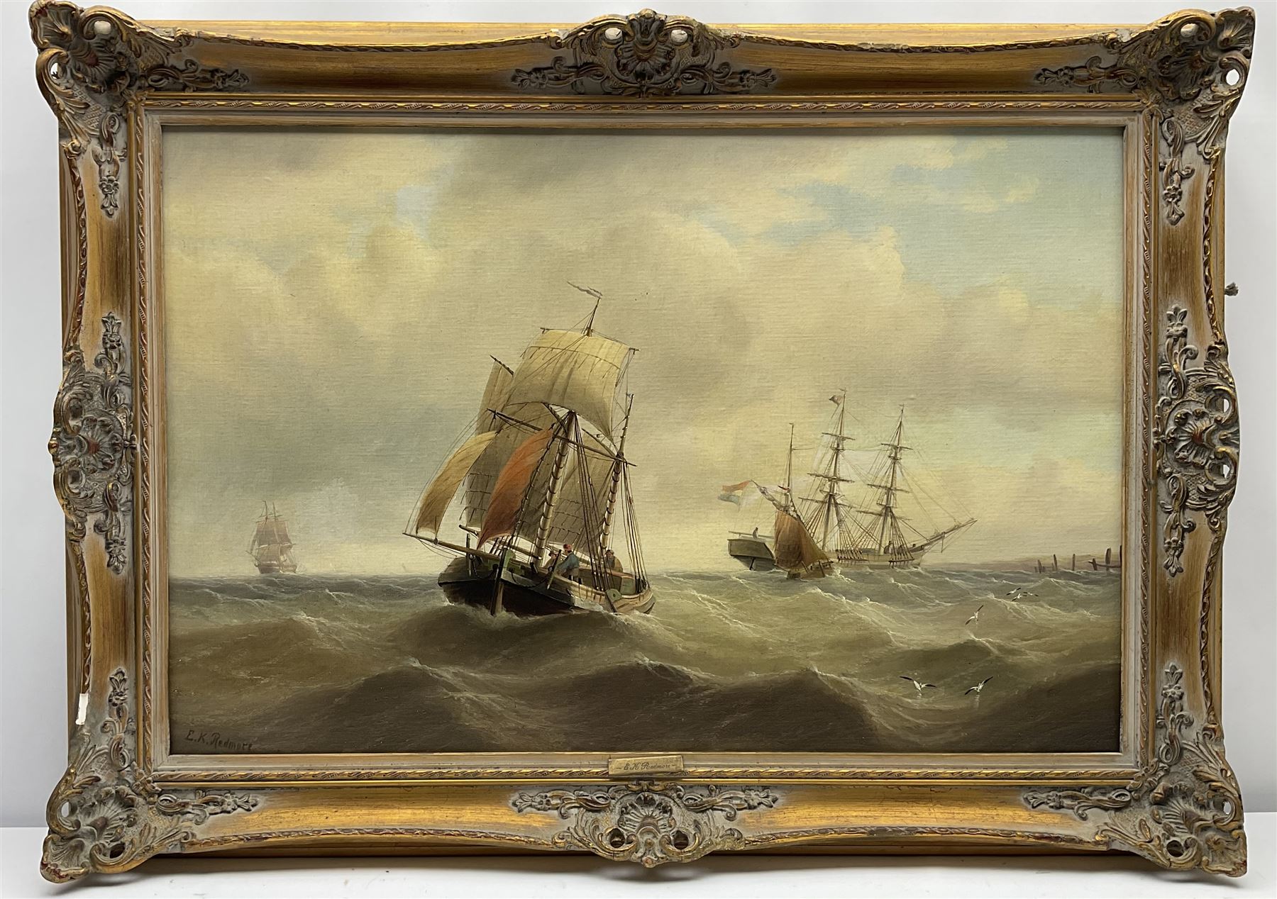 Edward King Redmore (British 1860-1941): Sailing Vessels off the Coast, oil on canvas signed 49cm x 74cm