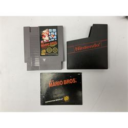 Nintendo Entertainment System (1985) console with two controllers, accessories and instruction booklet. NES Games ‘Duck Hunt’ with Nintendo Zapper gun, ‘Pinball’ and ‘Super Mario Bros.’, all with original sleeves and instruction booklets. NES game ‘Super Mario Bros. 2’ cartridge only