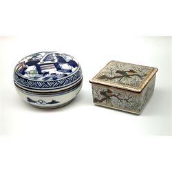 Chinese lidded square box decorated with birds perched on a tree with blossom H4cm and a Chinese blue and white decorated lidded round box with decorated interior, H5cm.  