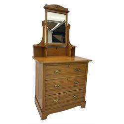 Edwardian satin walnut dressing chest, raised bevelled mirror back, the base fitted with three drawers