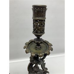 Pair of late 19th/ early 20th century brass candlesticks in the form of dolphins upon a stepped base with Fleur-de-lis design, H32cm 