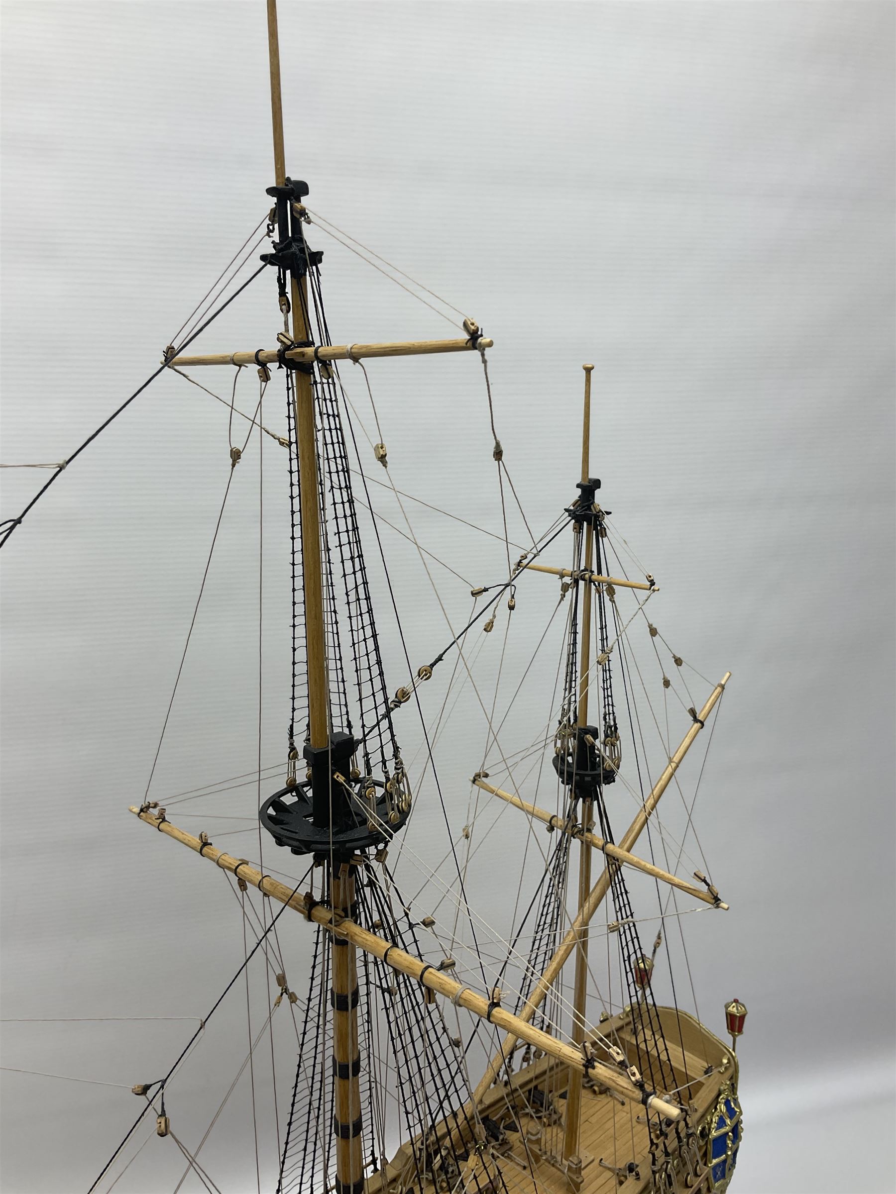 Wooden kit built model of HMS Neptune, 1:90 scale, with detailed rigging to three masts and a row of cannons to either side, upon ebonised wooden base, including stand H71cm