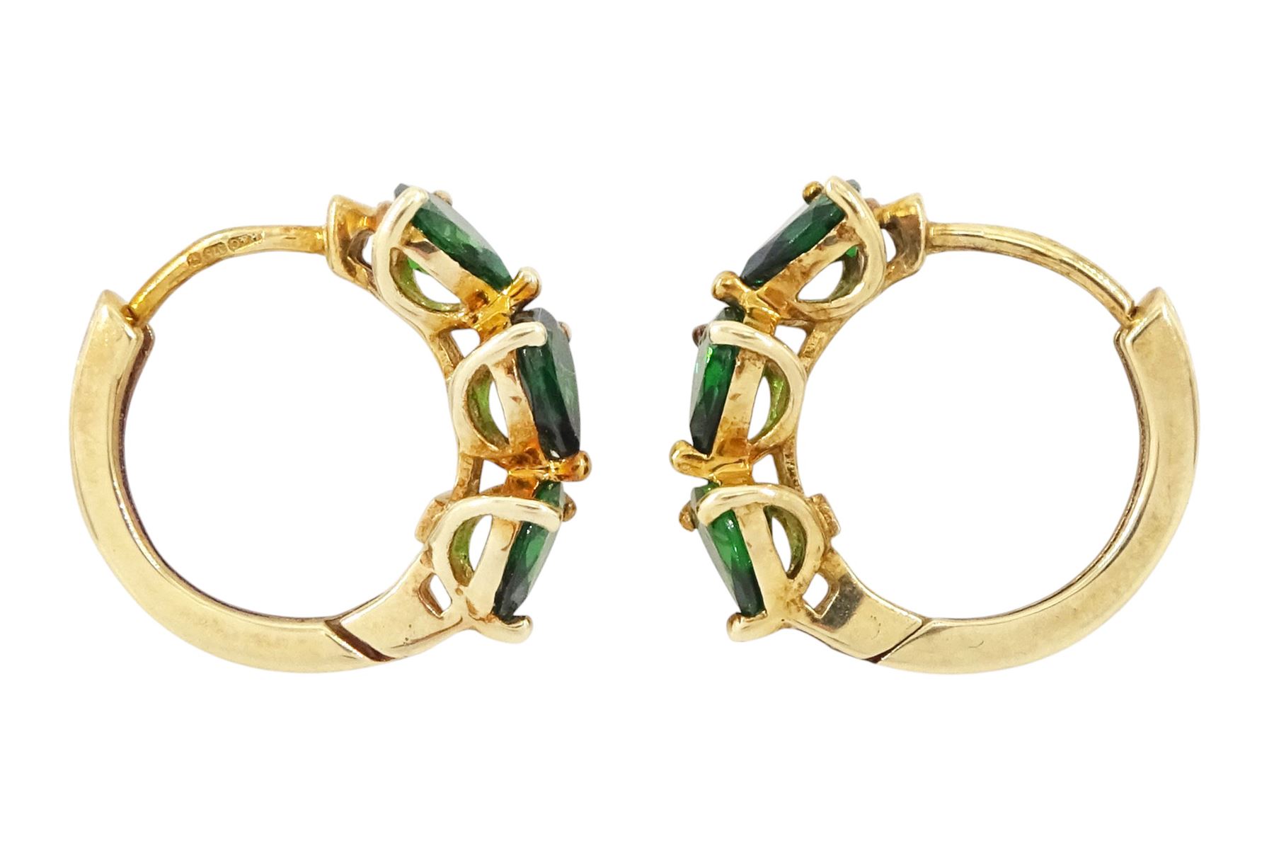 Gold tsavorite garnet ring and a pair of gold tsavorite garnet hoop earrings, both hallmarked 9ct