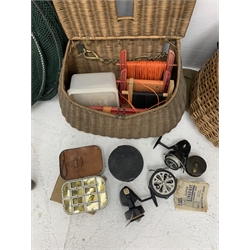Fishing tackle including a landing net, two creels, fly tin, small brass reel, other reels, crab lines etc 