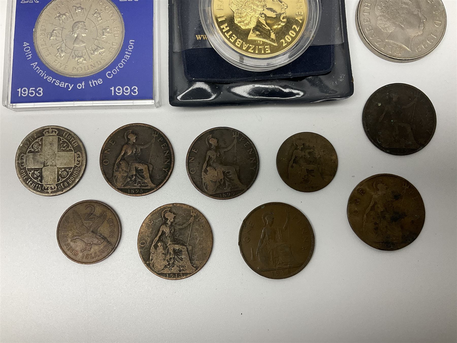 Two Great British Queen Elizabeth II five pound coins and a small number of other coins