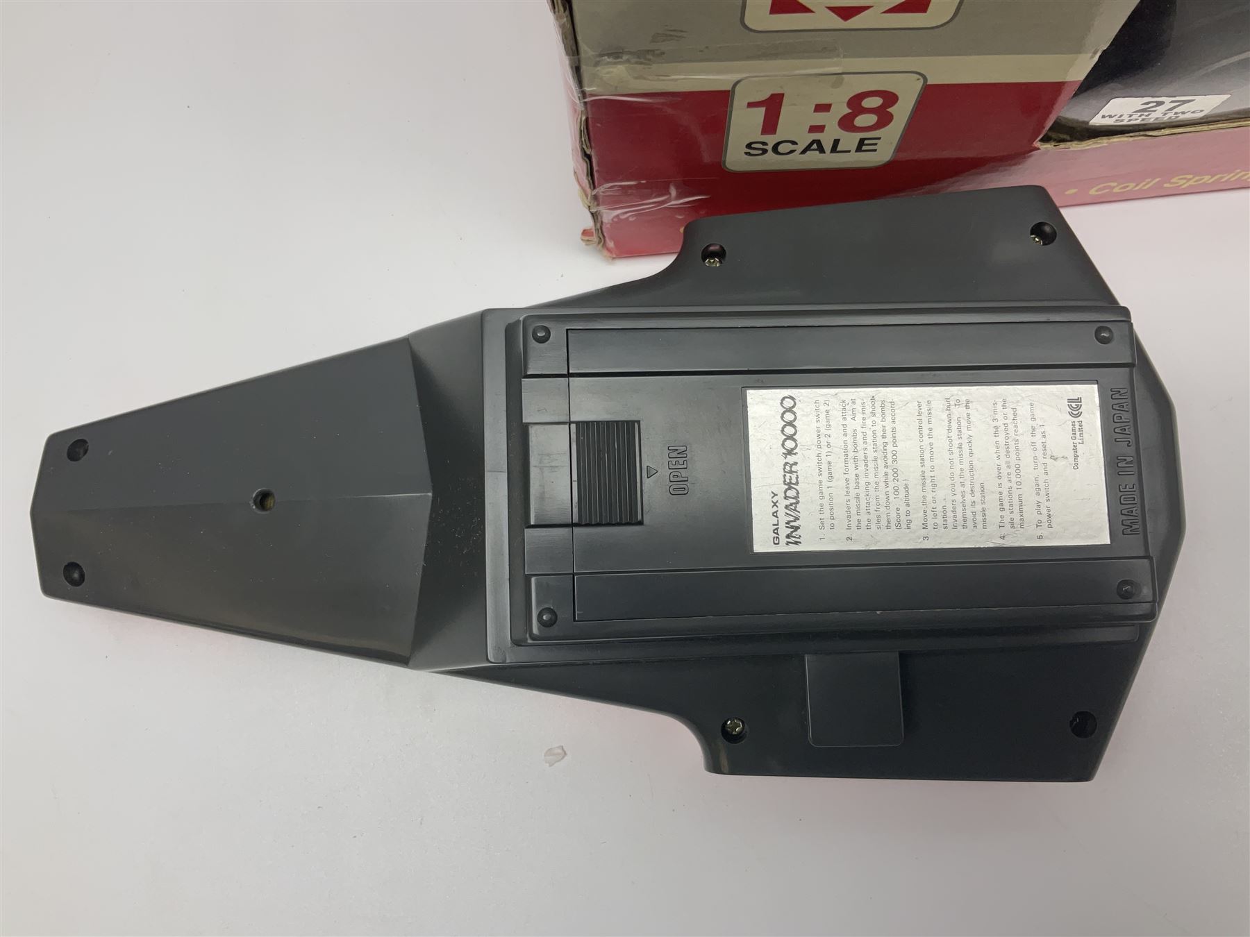 PMS Lightning 1:8 scale remote control racing car; Soma Sonic Man battery operated electronic sounds and light action figure; and CGL Galaxy Invader 10000 computer space battle game; all boxed (3)