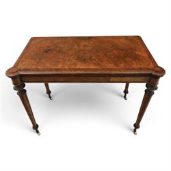 Victorian walnut card table, hinged rectangular moulded top with rounded corners and figured veneers, revealing a green baized lined interior, plain frieze with beaded lower edge, raised on ring turned tapering supports terminating in ceramic castors