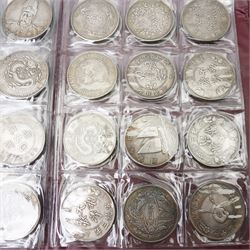 Folder containing various Chinese coins 