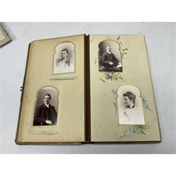Victorian photograph album with ornately gilded and hand painted covers and brass clasp, partially stocked with Victorian and later portraits etc; another well stocked Victorian leather bound photograph album relating to the Cawood family; three other Victorian leather bound photograph albums; and small quantity of stereoscopic cards