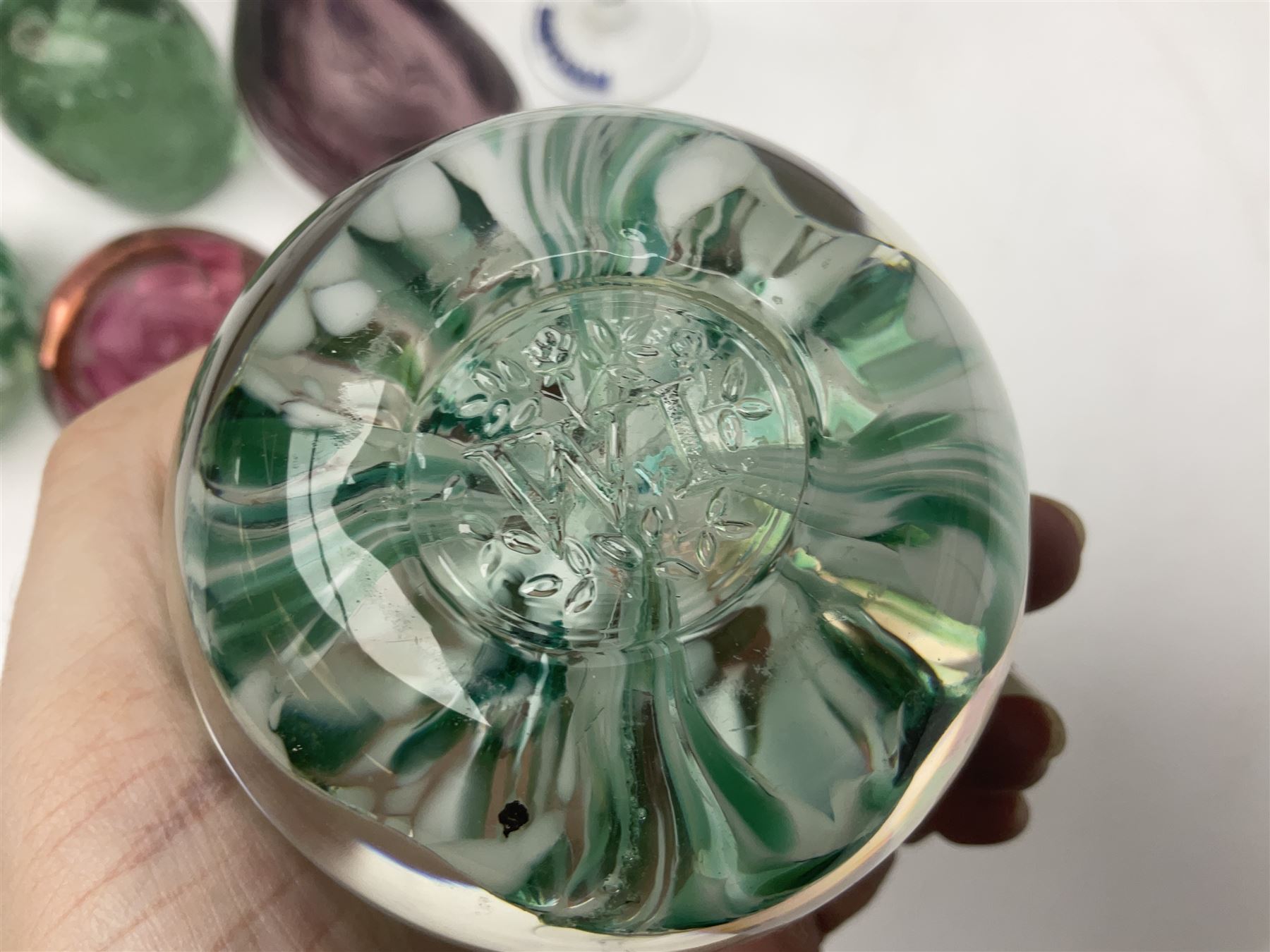 Five Babycham glasses, together with five paperweights, to include examples from Liskeard glass etc