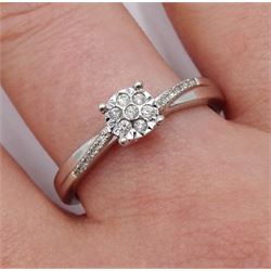 9ct white gold diamond cluster ring, with diamond set shoulders by Warren James, hallmarked, boxed with bag