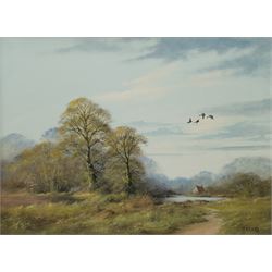 John Caesar Smith (British 1930-): Wooded Landscape with Geese in Flight, oil on canvas signed 29cm x 39cm