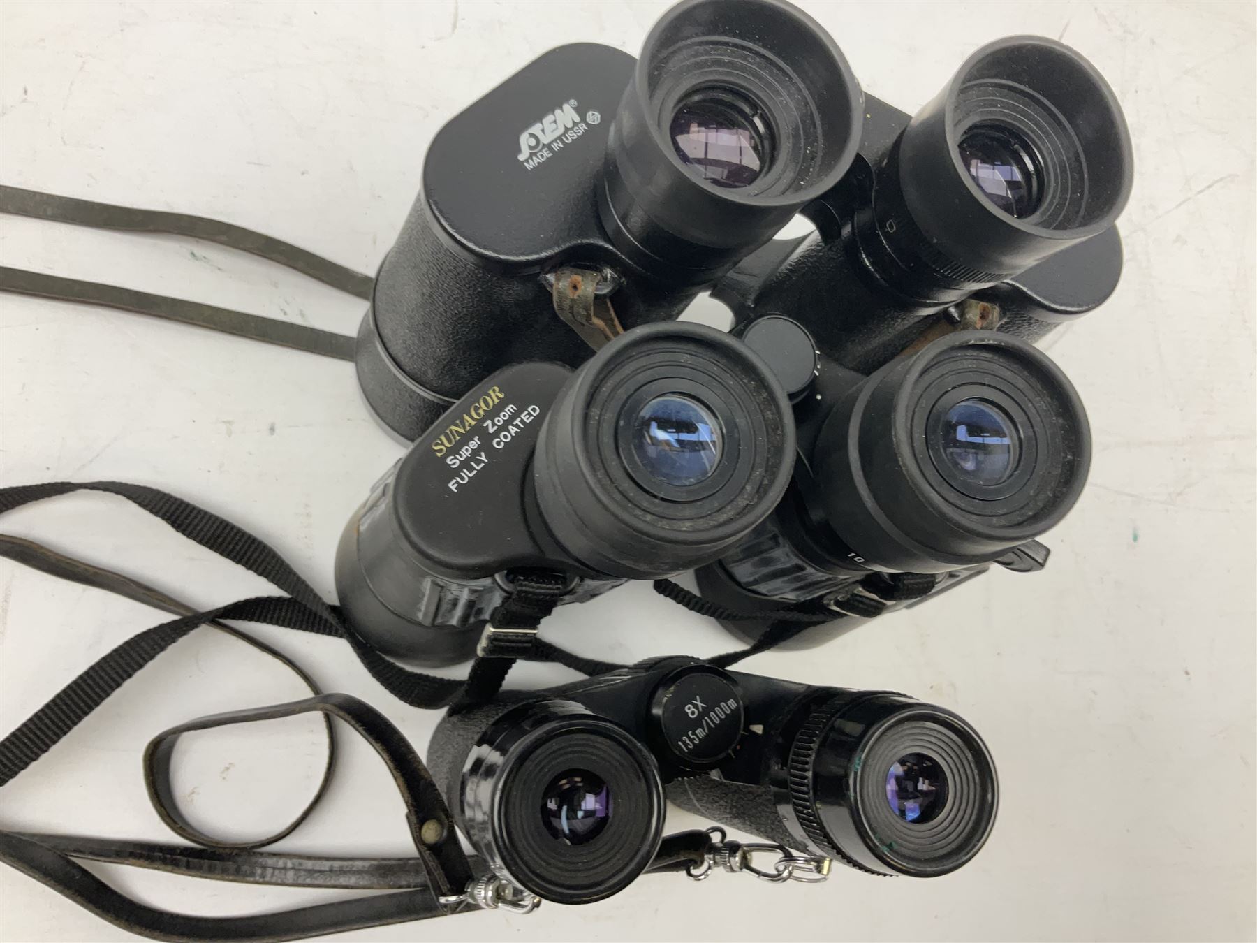 Eleven pairs of binoculars to include Lieberman & Gortz 20x65, Stem (USSR) 7x50, Helios 10x50 Field, Prinz 12x50, Tasco 8x40, Tasco 10x50, etc