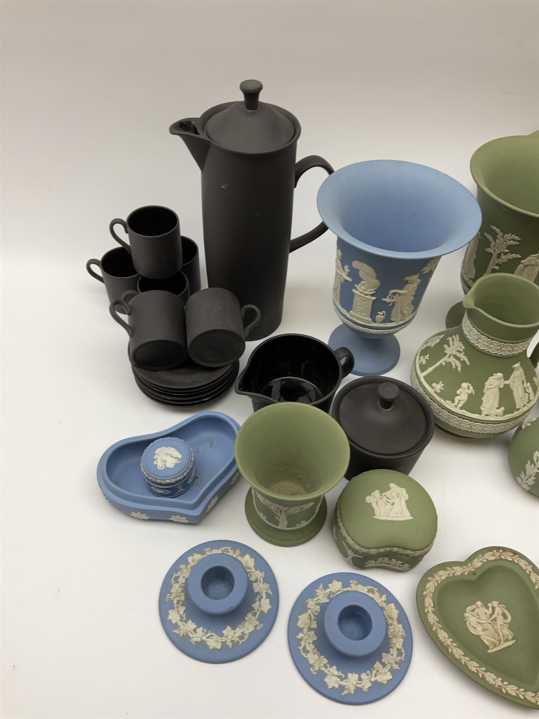 Collection of Wedgewood light blue and sage green Jasperware, to include blue bowl, D20cm, green footed bowl, D20cm, two large vases, trinket boxes, jugs, plates, etc., (29), together with a Wedgewood Black basalt coffee set, comprising coffee pot, milk jug, lidded sugar bowl and six coffee cans and saucers. 