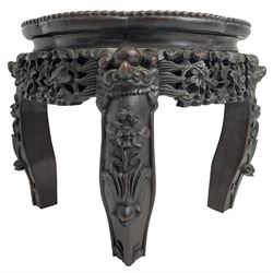 20th century carved hardwood jardiniere or plant stand, shaped circular top with inset marble surface and beaded border, pierced and carved apron with scrolling floral decoration, shaped supports applied with carved stylised flowers