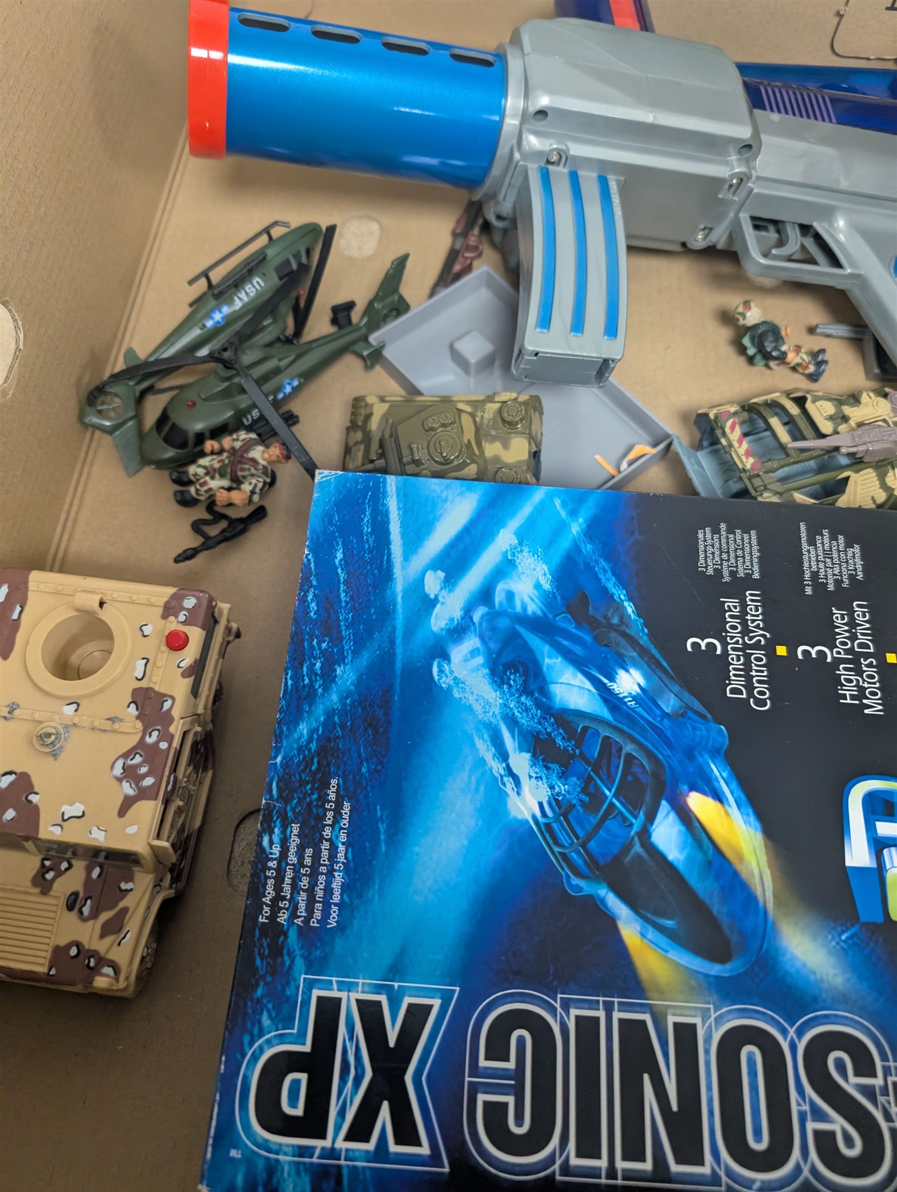 Collection of toys, including Matchbox Old Mother Hubbard's shoe, Tomy Zoids Blade Liger, Air Hogs radio controlled helicopter, diecast tanks etc, 