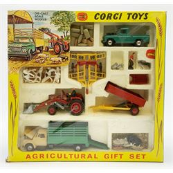 Corgi Toys Agricultural Gift Set No.5 containing Massey-Ferguson 165 Tractor with shovel and skip and churns attachment with two churns, Tandem disc harrow, farm tipper trailer with raves, Land Rover, Dodge Kew Fargo truck with four cattle and four pigs, farm worker and dog,  eleven large sacks and five small sacks, boxed