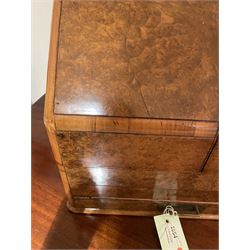 19th century burr walnut correspondence box, the sloped front opening to reveal a fitted interior with perpetual calendar, letter racks, and pen tray between two inkwell recesses, above a pull out draw with recessed brass handle, H41cm L40.5cm D28.5cm