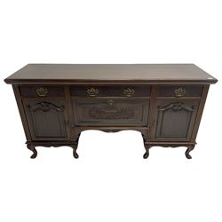 Late Victorian walnut sideboard, moulded rectangular top over three drawers  with blind fretwork facias, fitted with central fall front cupboard with extending foliage carved decoration and two flanking panelled cupboards, on acanthus carved cabriole feet