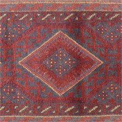Afghan hand-knotted wool runner, dark red and indigo blue madder, with a repeating central diamond medallion design within multiple geometric borders, with flatweave ends 