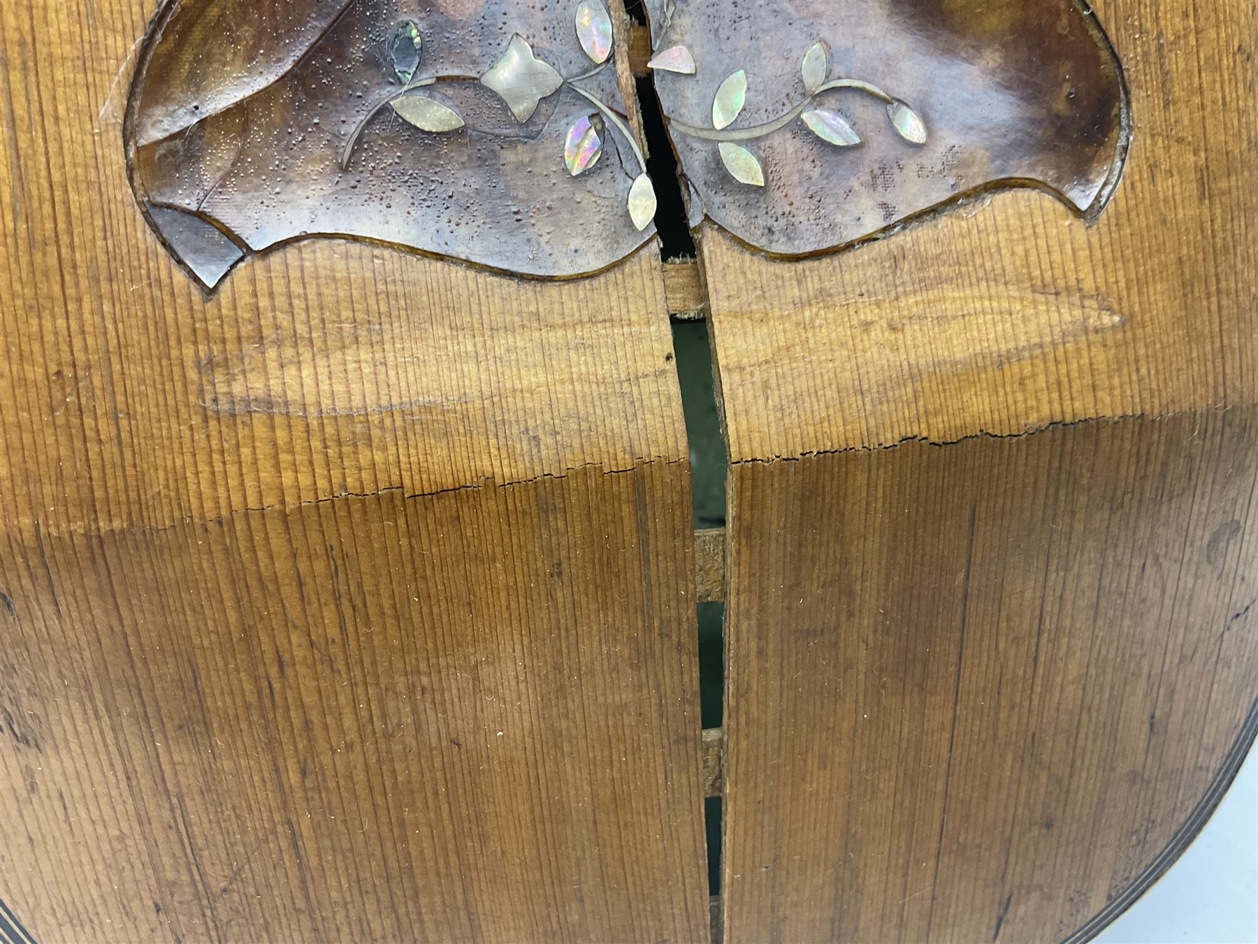 Late 19th century Italian lute back mandolin with segmented bowl back, bears label Gennaro Maglioni Napoli L61cm; in ebonised wooden case; together with another similar damaged Italian lute back mandolin for restoration or spares (2)