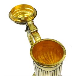 Georgian silver-gilt wine flagon with spiral ribbed body scroll handle and hinged cover, hallmarked London 1725, with later refinements (re-struck by the London Assay 2021), approx 58oz, height 33cm