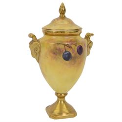 Coalport pedestal vase and cover, of urn form hand painted with fruit with gilt detail, signed J Mottram, H18cm
