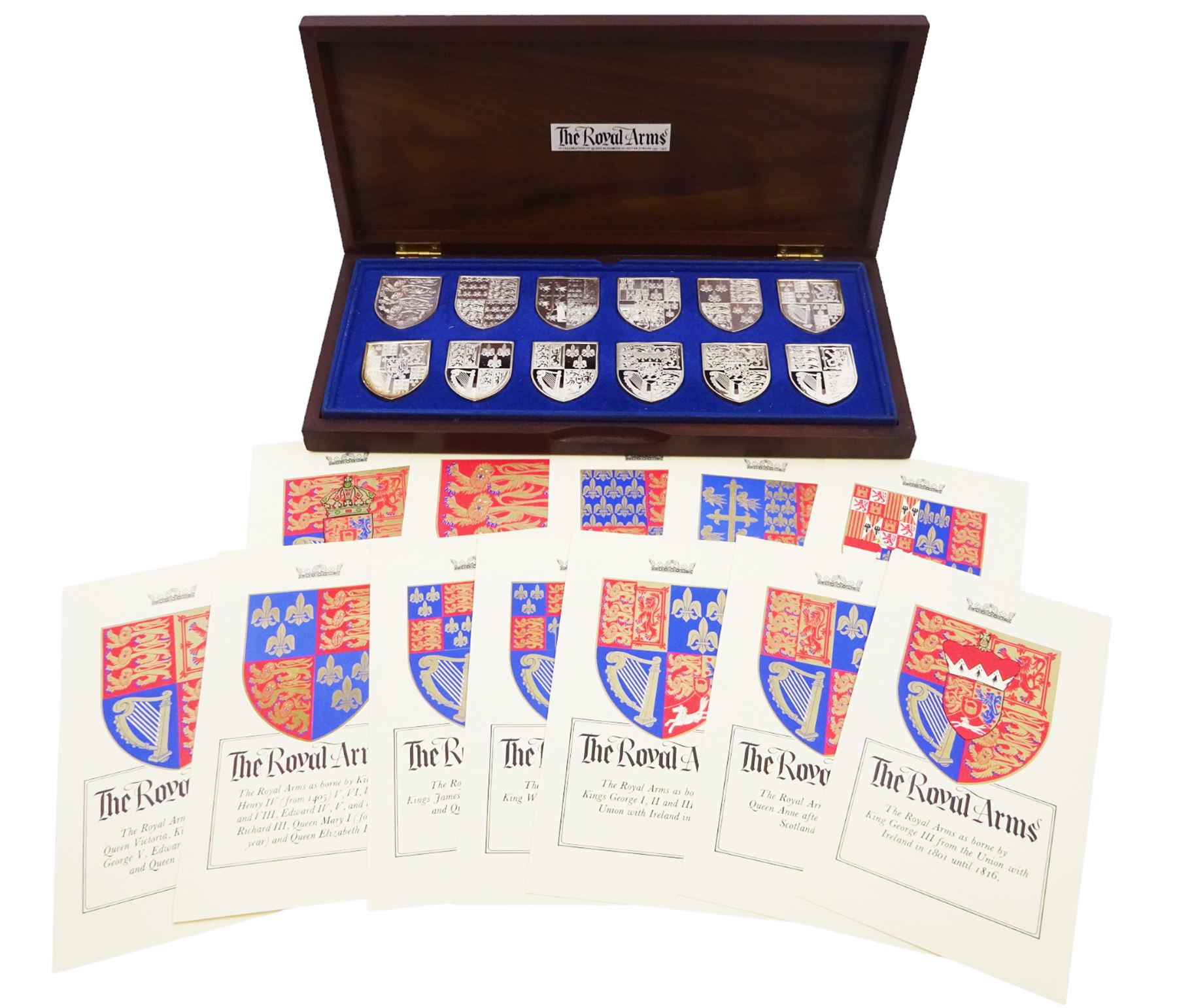 Yorkshire Mint, The Royal Arms Collection, twelve shield shaped silver medallions each depicting variations on the Royal coat of arms, each hallmarked Yorkshire Mint, Birmingham 1976/77, contained within fitted wooden case with associated information cards