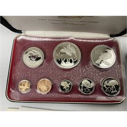 Four Papua New Guinea proof eight coin sets, from ten kina to one toea, comprising First Coinage of Papua New Guinea 1975 proof set, 1976, 1977, and 1979 proof sets, the 1977 and 1979 sets containing 925 silver ten kina and 500 silver five kina coins, all minted at the Franklin Mint, cased with certificates (4)