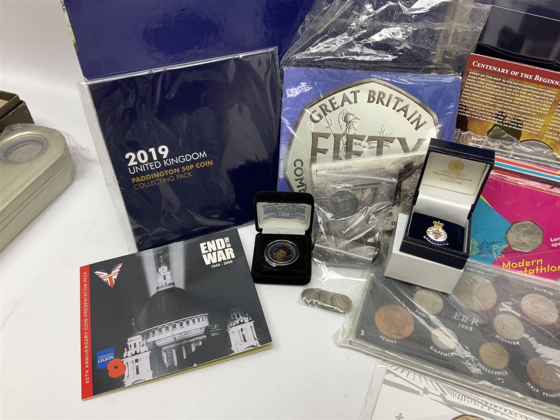 Commemorative and other coinage, including various Queen Elizabeth II 'London 2012 sports collection' fifty pence coins on cards, commemorative crowns, Millennium 2000 'Time Capsule' coin set, channel islands old round one pound coins, part sets etc