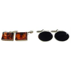 Two pairs of silver stone set cufflinks, one pair set with Whitby jet, the other set with Baltic amber, hallmarked or stamped, boxed 