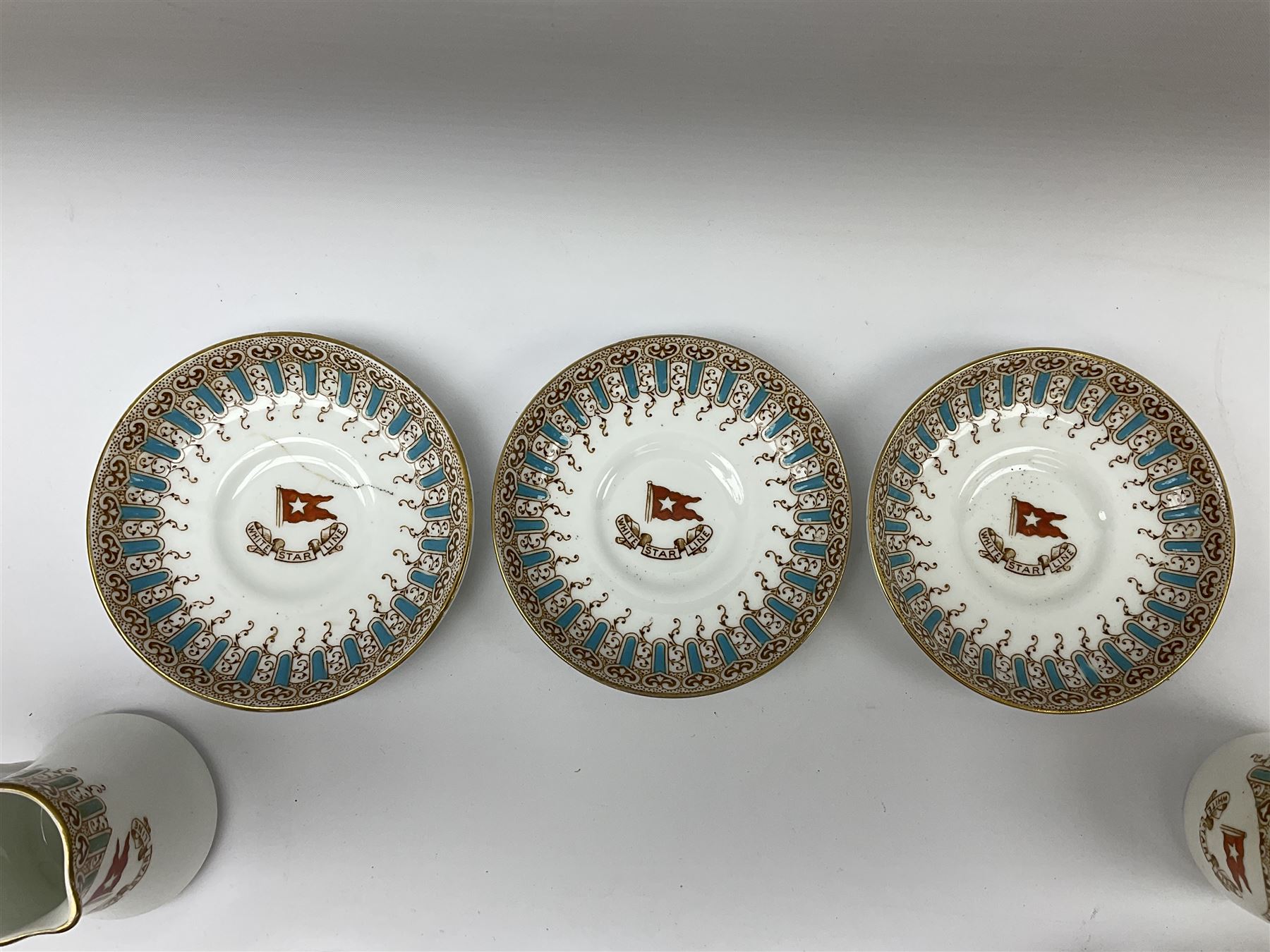 White Star Line, six pieces of porcelain by Stonier & Co. Liverpool, comprising four tea cups, three saucers, jug and three pin trays, registered design no. 117214/324028, printed mark beneath 