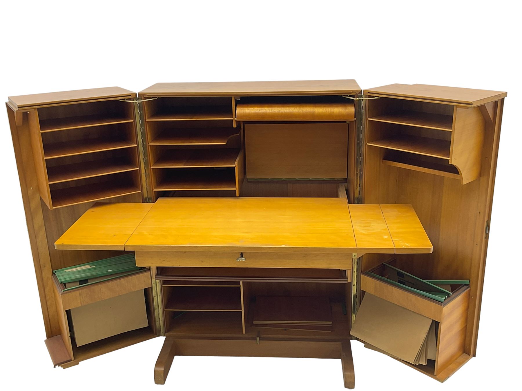 Mid-20th century walnut 'Magic Box' design metamorphic desk cabinet, two doors open to reveal sliding desk with drop leaves, document divisions and internal lamp, on sledge supports 