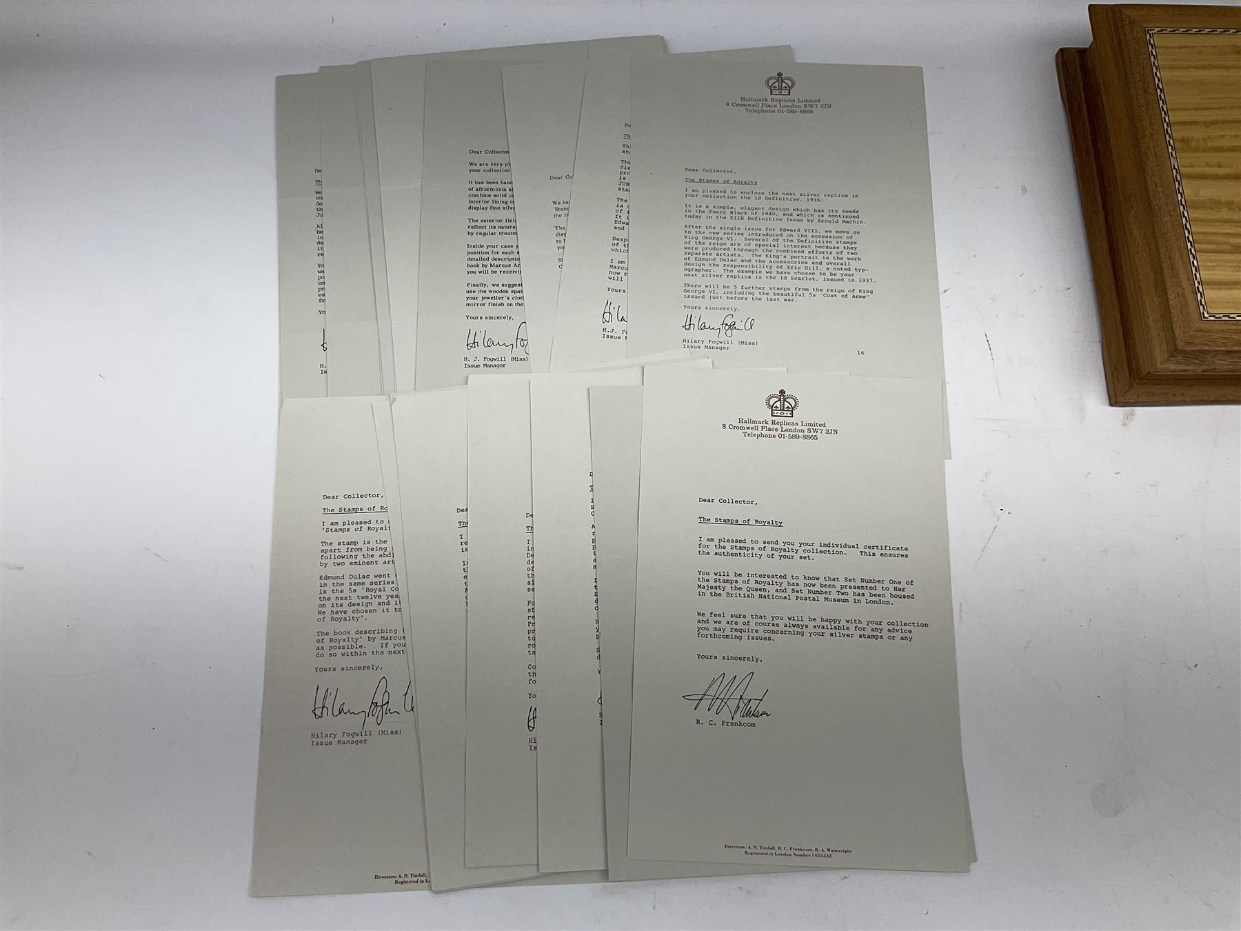 The Stamps of Royalty collection consisting of twenty-five sterling silver hallmarked stamp replicas, housed in a fitted wooden display case, with certificates, polishing cloth and certificates