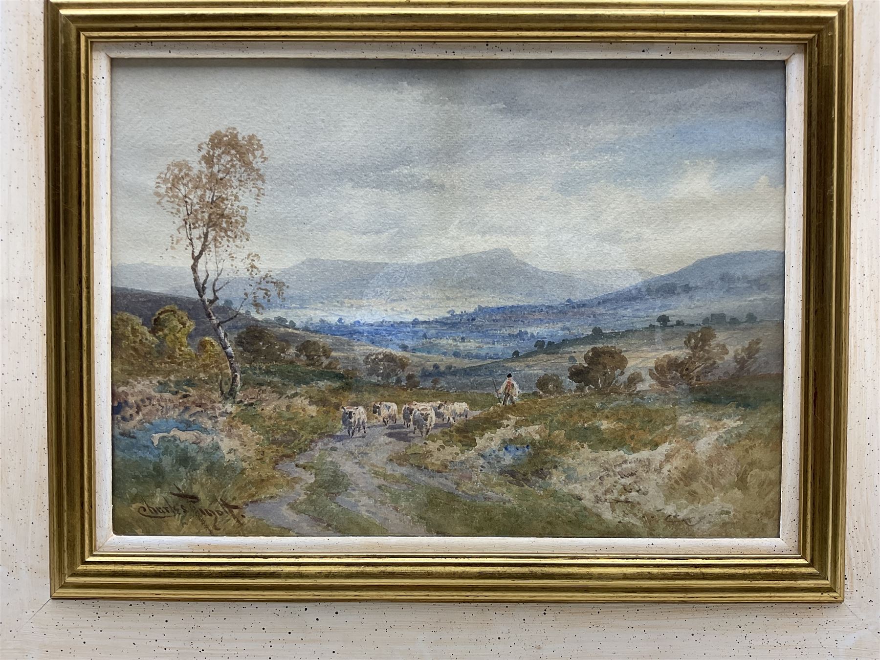 Charles Pigott (British 1860-1940): Driving Sheep in the 'Derbyshire Hills', watercolour signed, titled verso 25cm x 35cm; M Reid (British early 20th century): Ploughing, watercolour signed and dated 1920, 25cm x 36cm; together with a further unsigned landscape watercolour 16cm x 24cm (3)