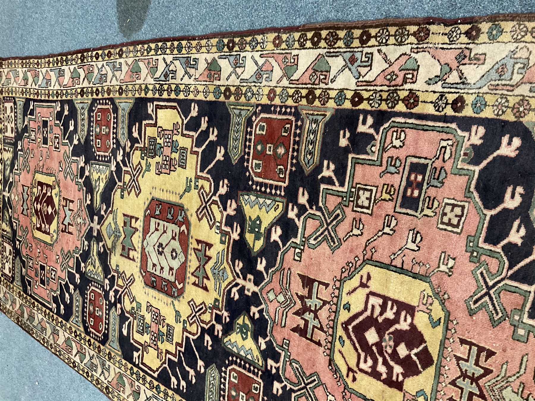 Turkish design blue and beige ground rug, triple medallion, repeating border