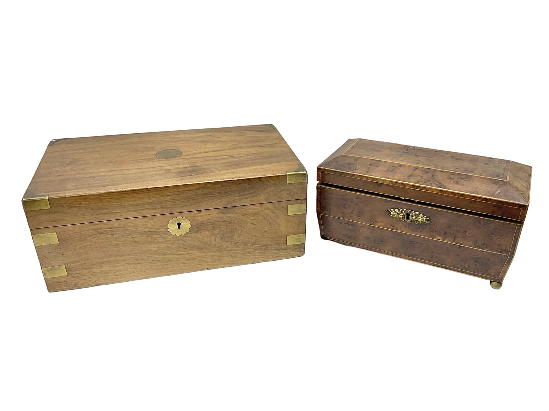 19th century burr yew wood tea caddy, of sarcophagus form, with strung details and brass mounts, the interior split into three compartments, upon four brass bun feet, together with an oak and brass bound writing slope, with red leather interior with gilt detailing, largest H16cm, W40cm